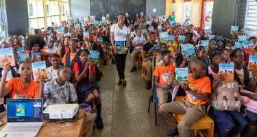NCCA Officer Dr. Roxanne Graham-Victor engaging students of primary school about the NAP