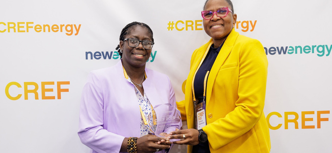 L-R: Ms Niebert Blair, Advisor, NDC-TEC, and Professor Tannecia Stephenson, UWI Mona Campus, Jamaica receive Best E-mobility Programme Award at the 7th Annual Caribbean Renewable Energy Forum (CREF) in Miami in May 2025. 